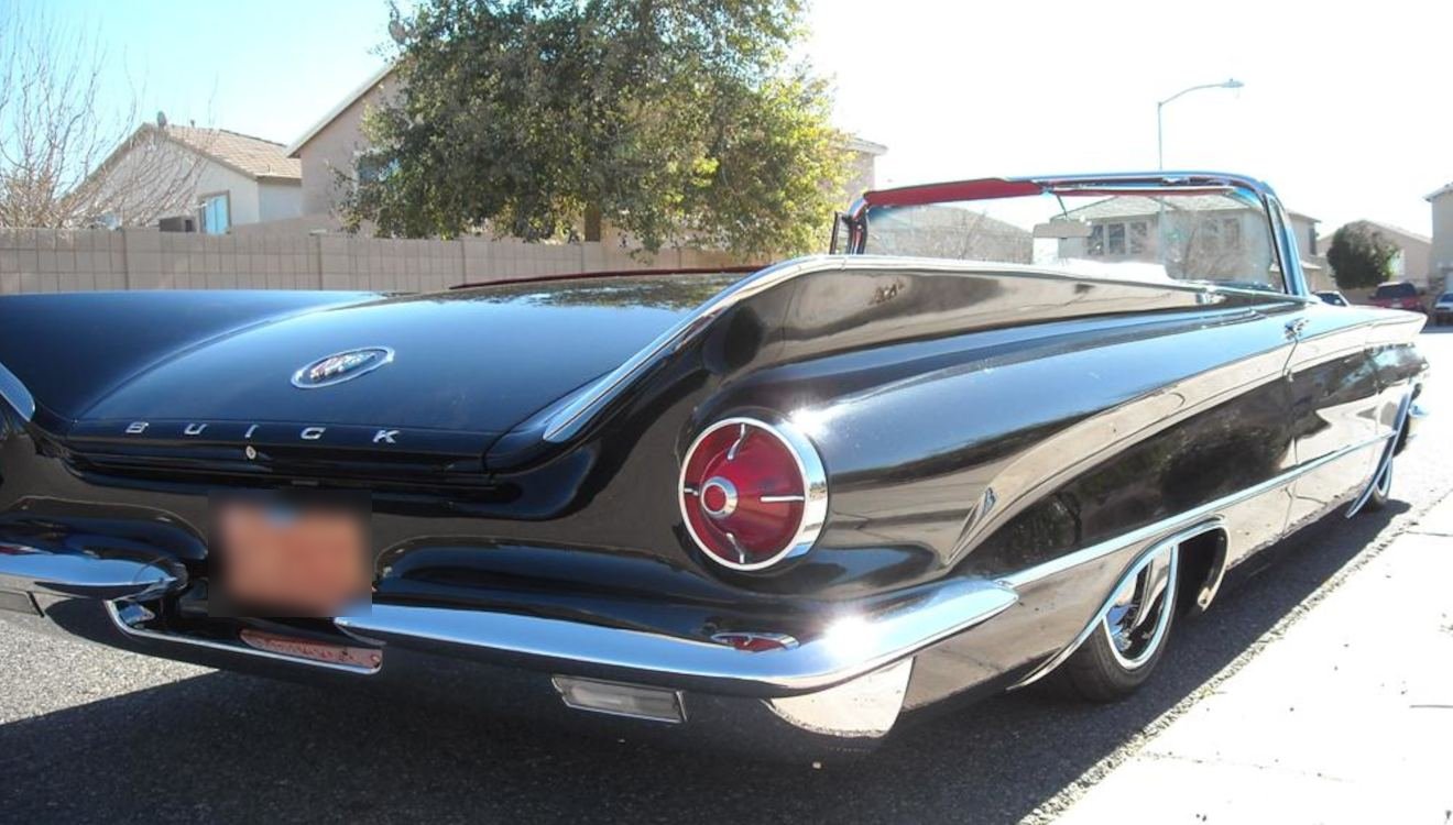 Rear of a black 1960 Buick Invicta convertible