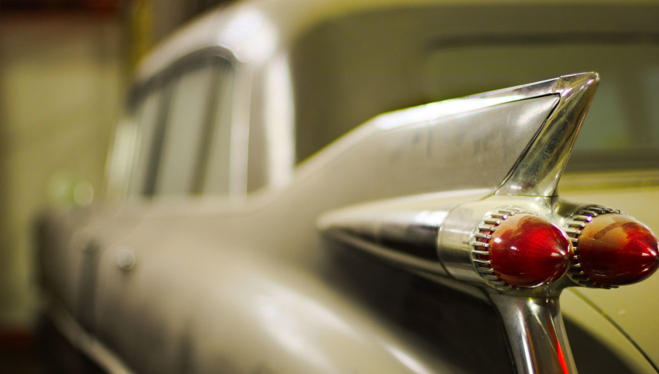 Tail fin and bullet taillights of a 1959 Cadillac