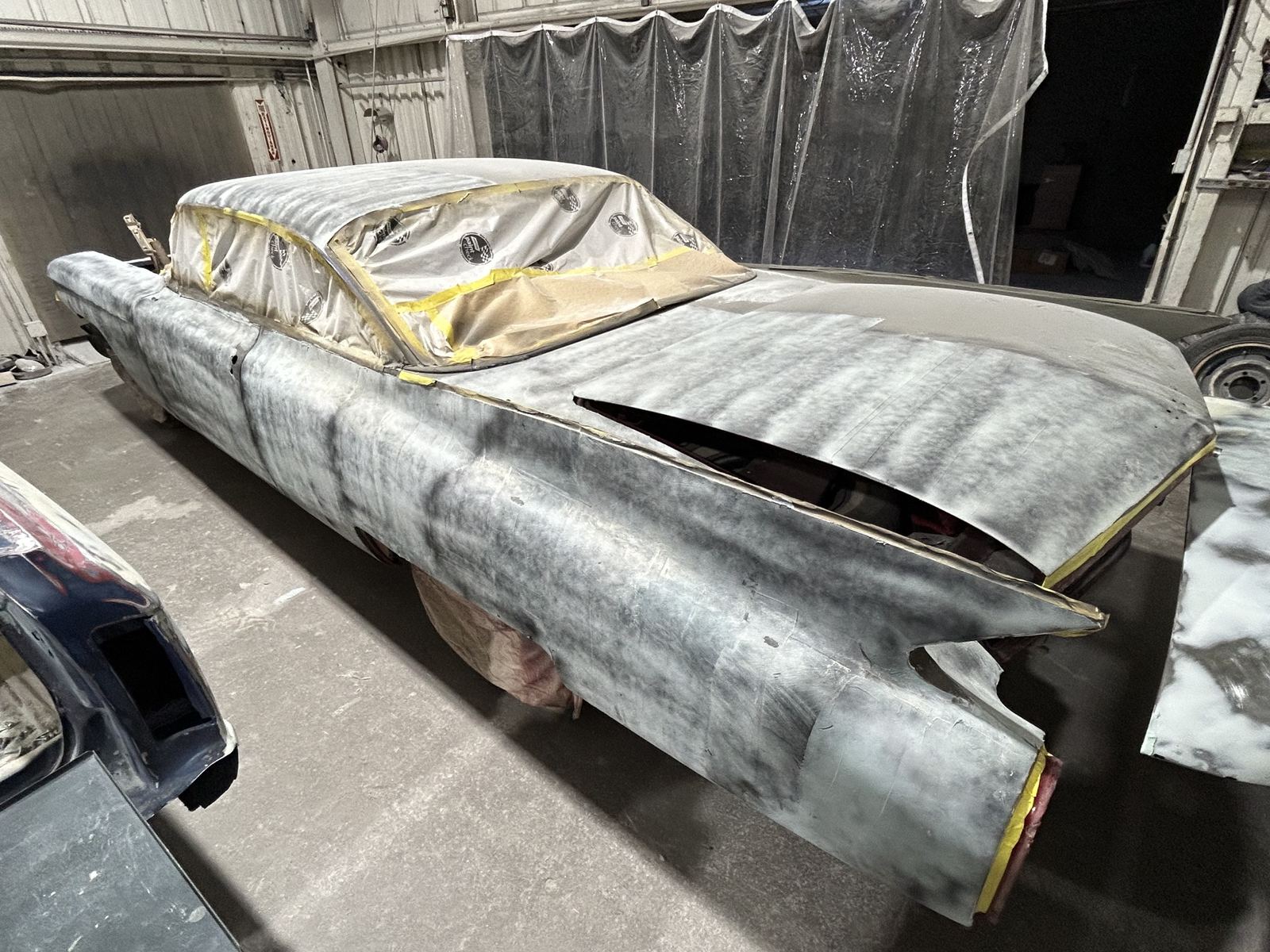A 1959 Cadillac coupe in guide coat during block sanding