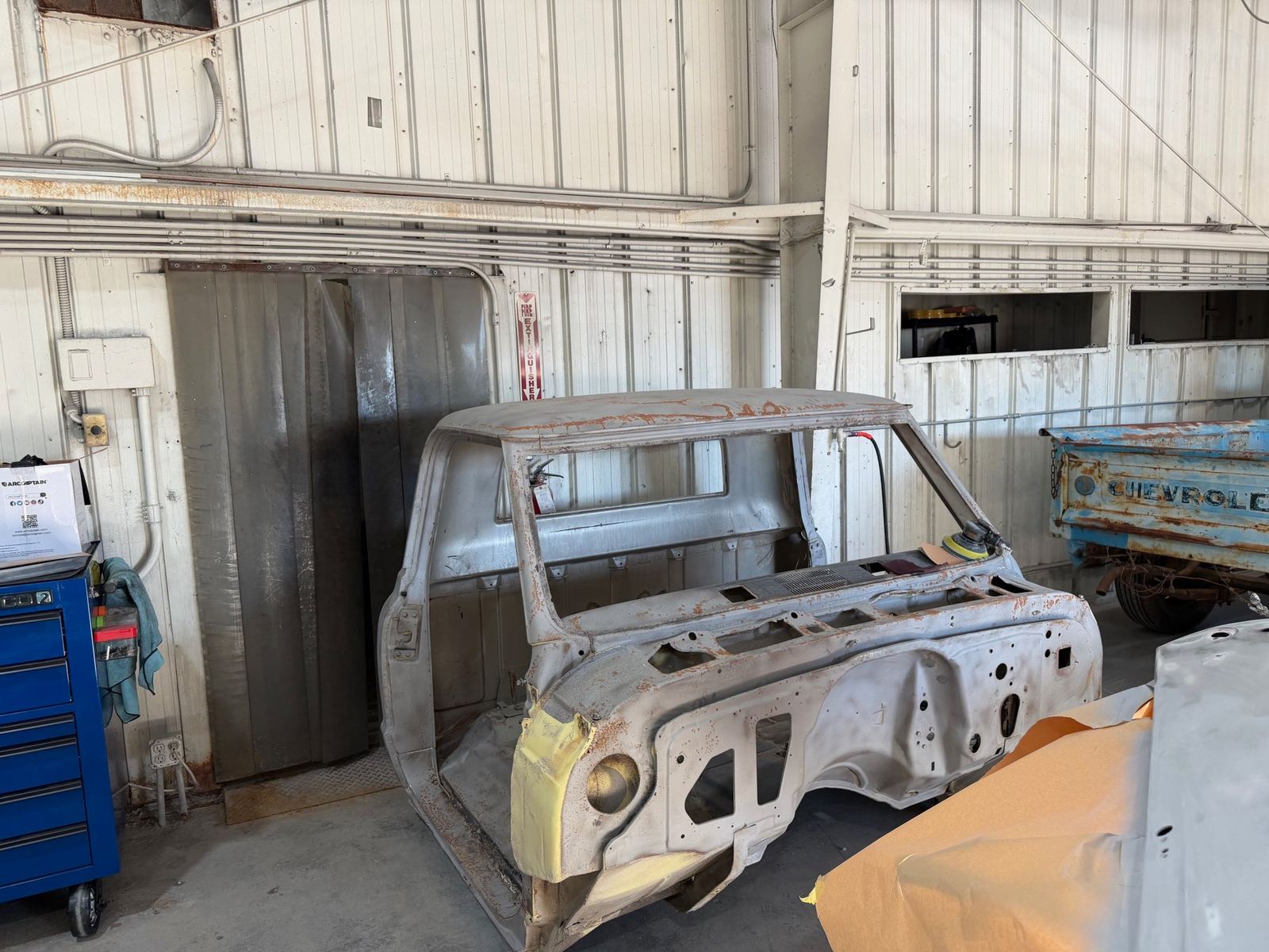 A Chevrolet C10 cab stripped to bare metal