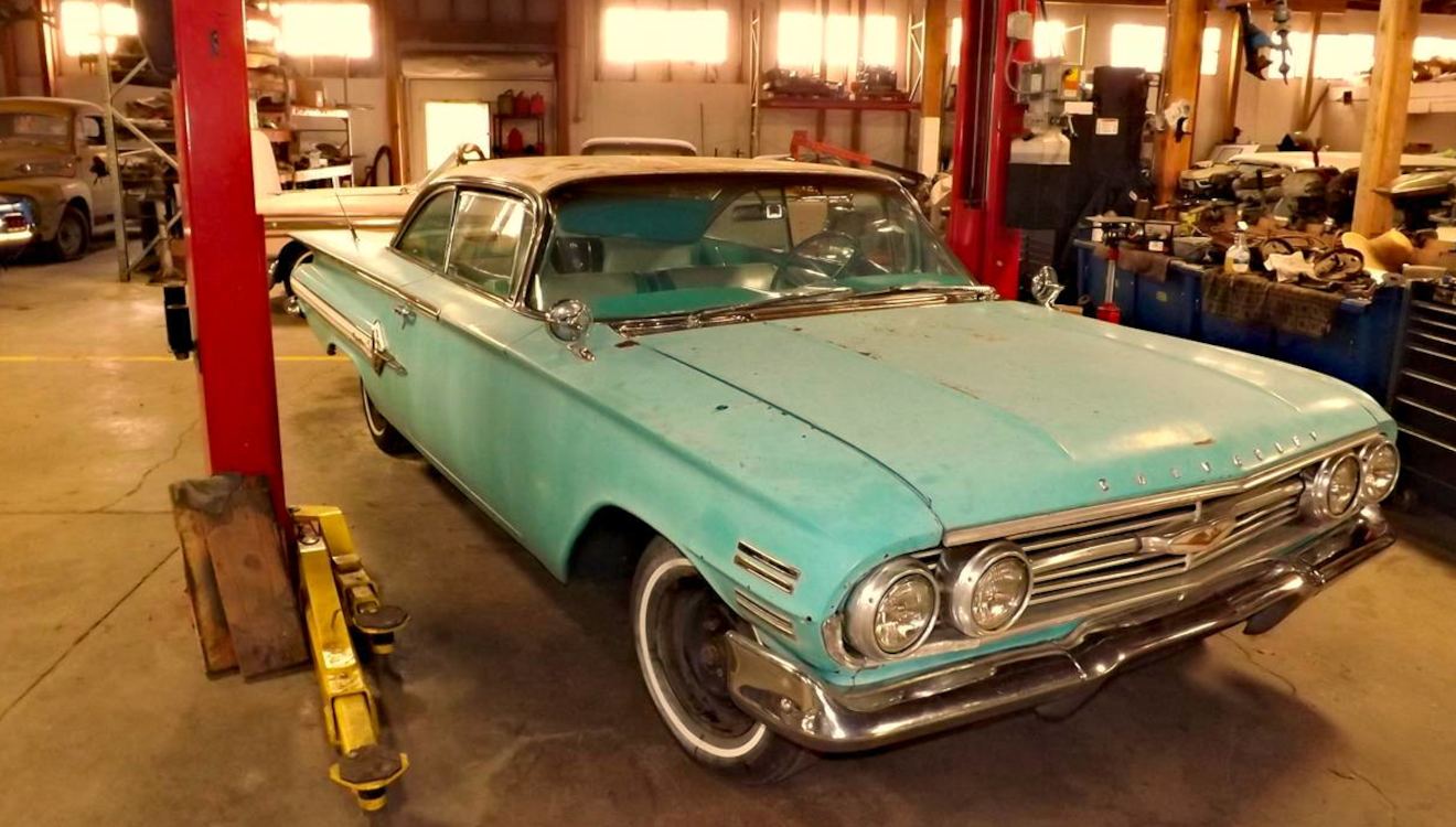 1960 Chevrolet Impala on a lift in the shop