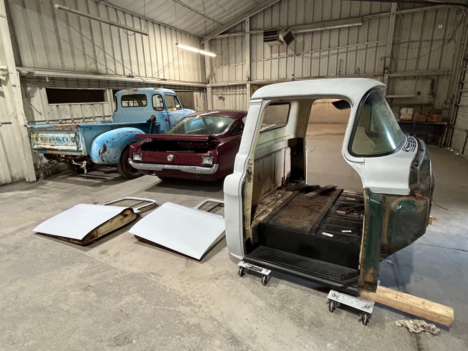 A 1950s Chevrolet pickup cab and doors in primer