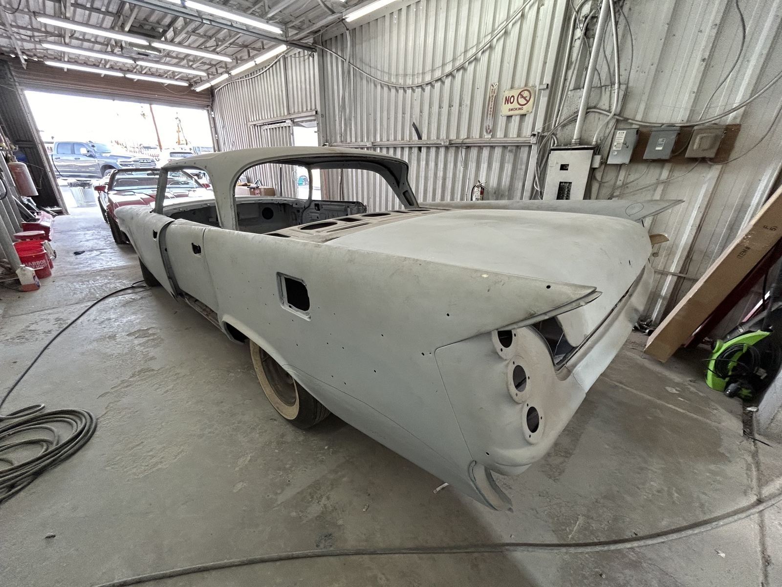 A 1959 DeSoto body in primer, seen from the rear