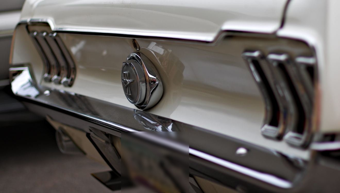 Taillights of a white classic Ford Mustang