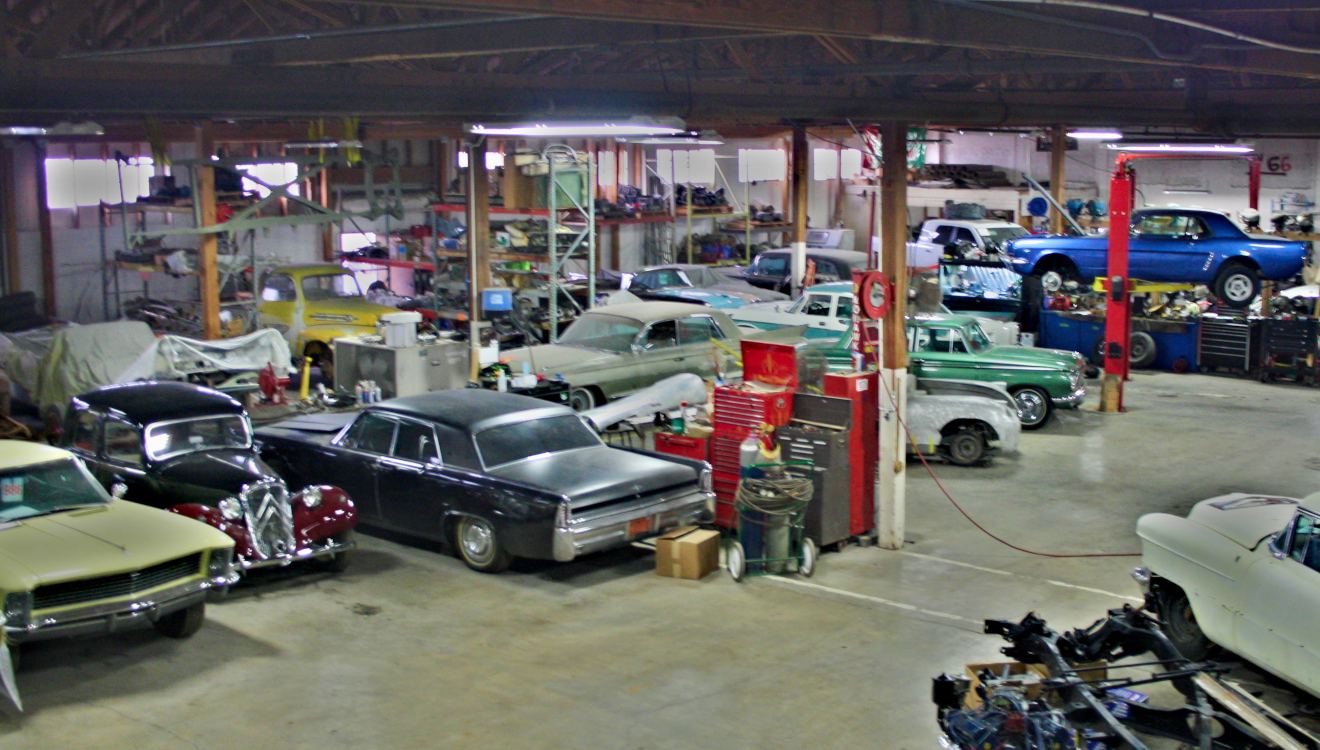 Classic cars and lifts inside the shop